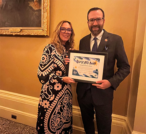 Julie Baker presenting Senator Allen with the Legacy Arts Award