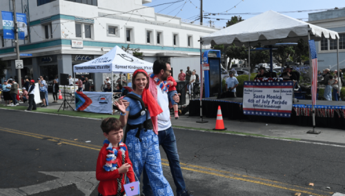 Senator Allen and his family walk down the street in Santa Monica's 4th of July Parade