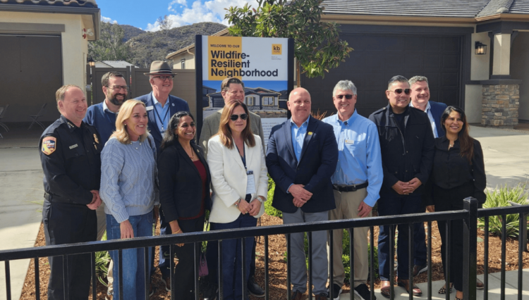 State and local leaders pose during a tour of a Fire Safe neighborhood and Escondido.