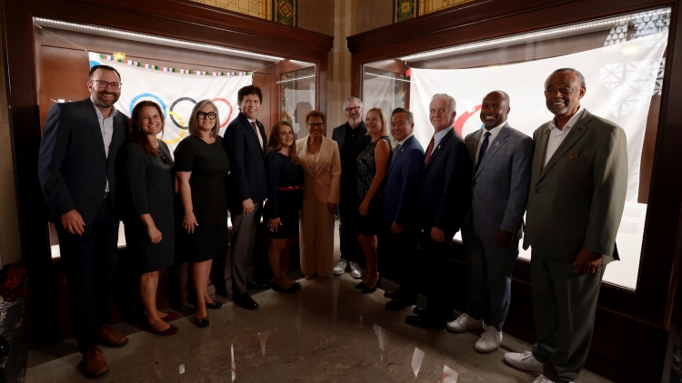 Group Photo in front of Olympic Flag for LA28