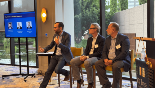 Senator Allen speaks from a panel at an insurance conference