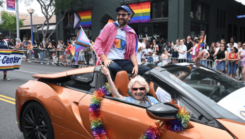 Senator Allen sits in the back of a car during the WeHo Pride Parade